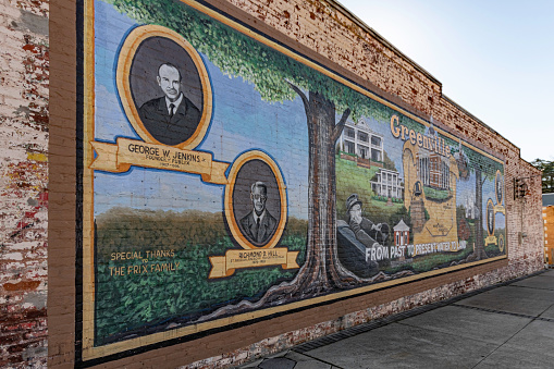 Greenville, Georgia, USA-Nov. 14, 2020: Large mural depicting Greenville's past and heritage made possible by Go Georgia Arts.