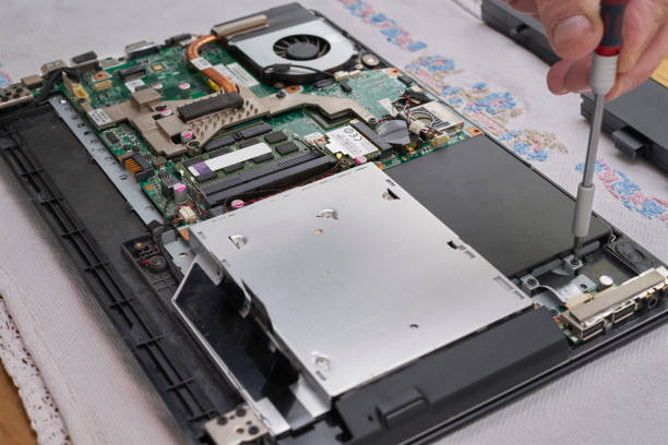 istock Laptop repair. Mount SSD disk. Hand screwdriver 1331360261