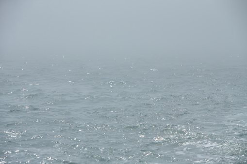 Beautiful line of the horizon, dissolving in the mist. Irish sea in fog. Foggy weatherBeautiful line of the horizon, dissolving in the mist. Irish sea in fog. Foggy weather