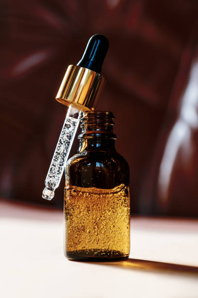 istock Pipette with cosmetic oil in a brown bottle with bubbles 1331364215