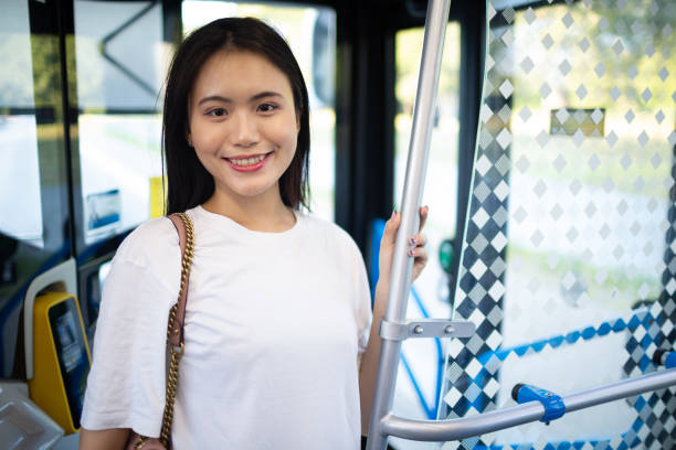 istock Asian Woman take a ride in public transport bus or tram. 1331365310
