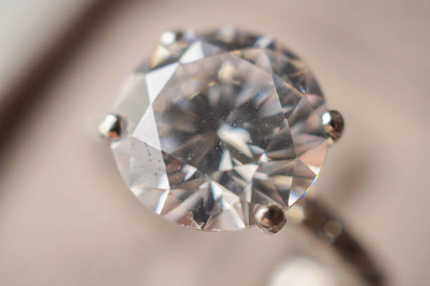 istock Diamond ring in jewelry gift box close up background 1331365346