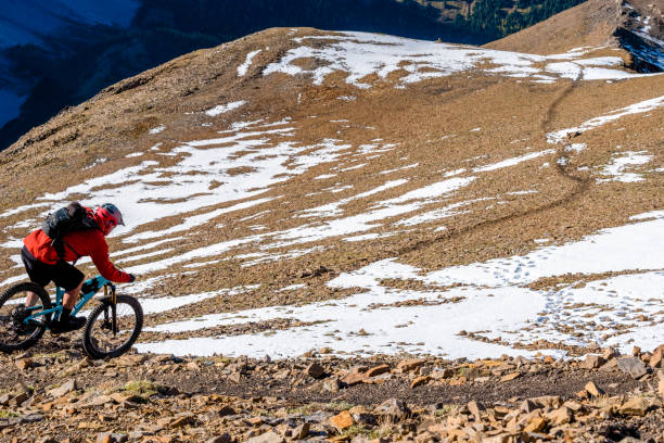istock View of mountain biker descending mountain ridge 1331365896