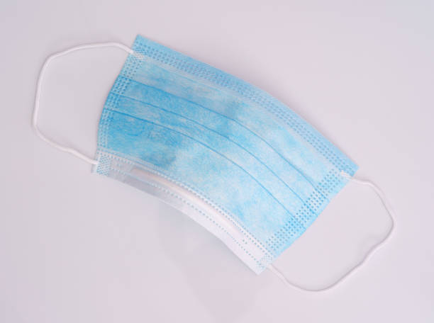 istock Surgical medical mask on white background 1331382144