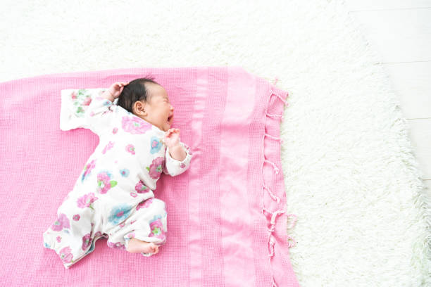 istock Sleeping baby on the floor 1331386299