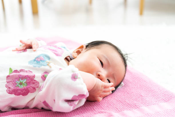 istock Sleeping baby on the floor 1331386303