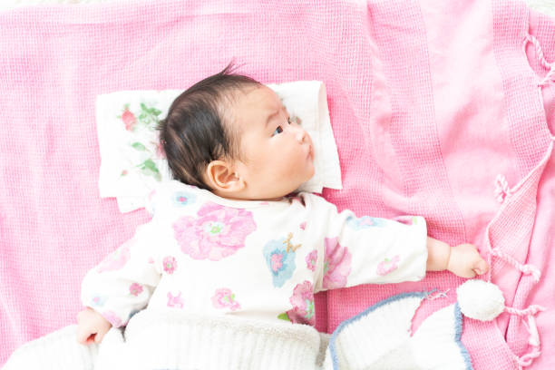 istock Sleeping baby on the floor 1331386315