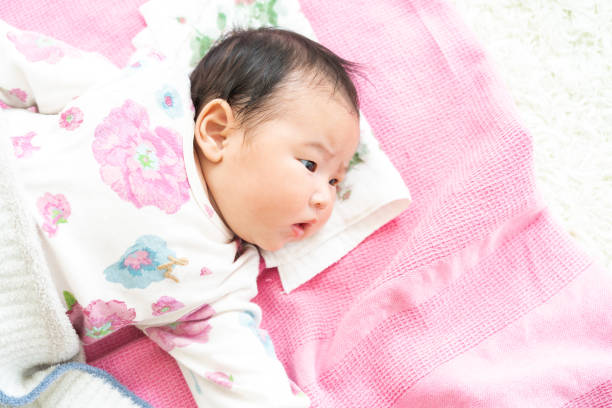 istock Sleeping baby on the floor 1331386316