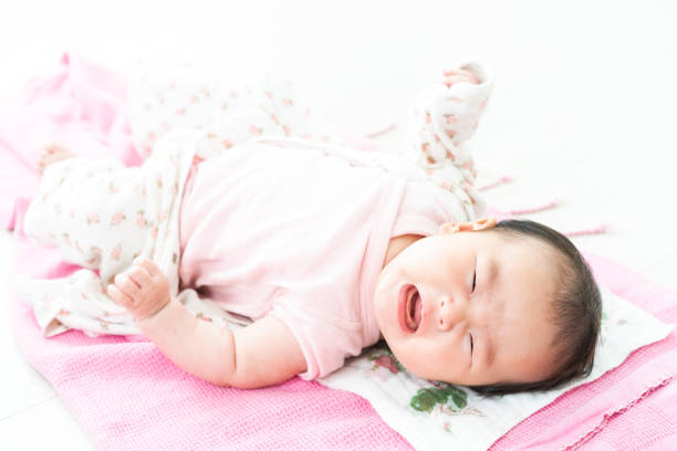 istock Crying baby on the floor 1331389389