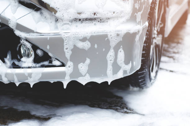 Outdoor car wash with foam soap. stock photo