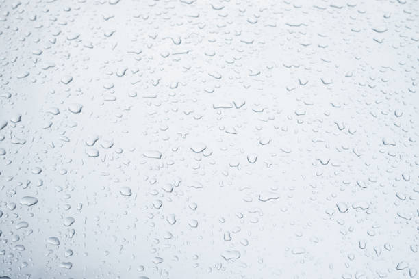 istock Rain drops and dew. water drops on a gray car roof after stopped raining , selective focus waterproof surface. soft focus. Leave space for writing text background. 1331391393