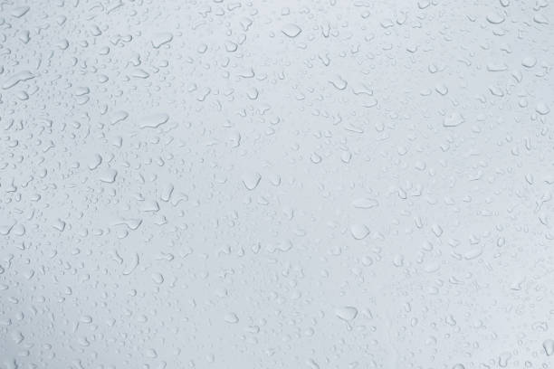 istock Rain drops and dew. water drops on a gray car roof after stopped raining , selective focus waterproof surface. soft focus. Leave space for writing text background. 1331391529