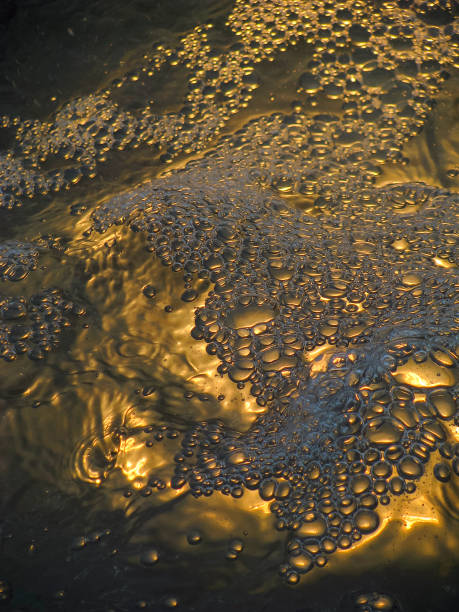istock Bubbles in water and artificial light in the background 1331394213