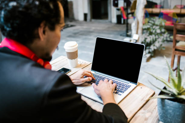 istock latin man working with computer at office in Mexico city 1331394386
