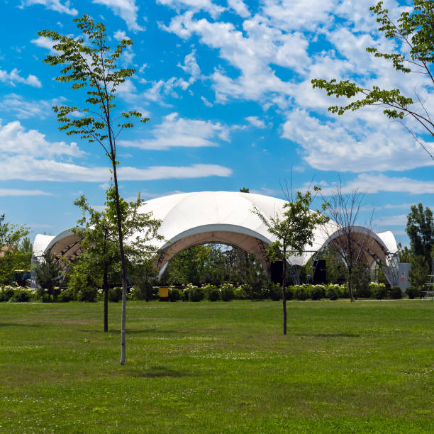 istock A white tent for celebrations in a lovely green glade, decorated 1331397112