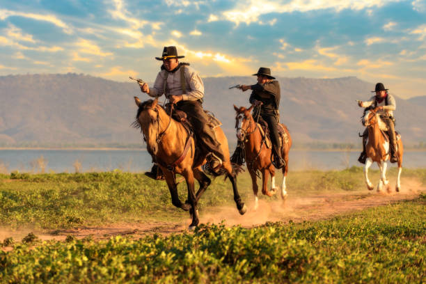 istock Cowboy riding a horse. 1331397527