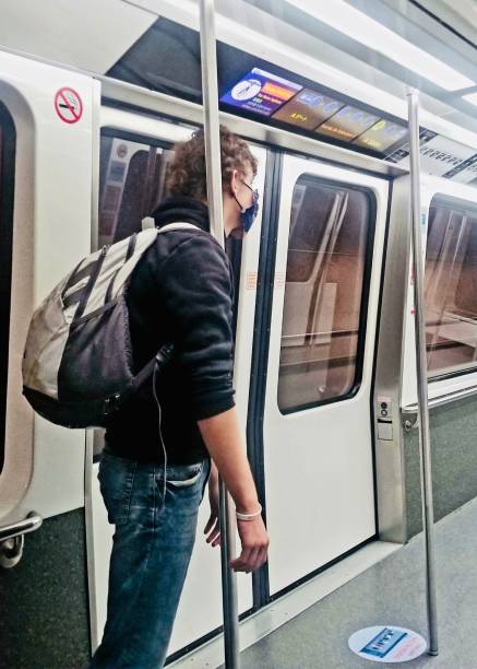 istock Teenage boy using public transportation during Coronavirus pandemic 1331397607