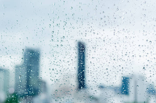 istock Rain drop on glass window at day time in monsoon season 1331409314