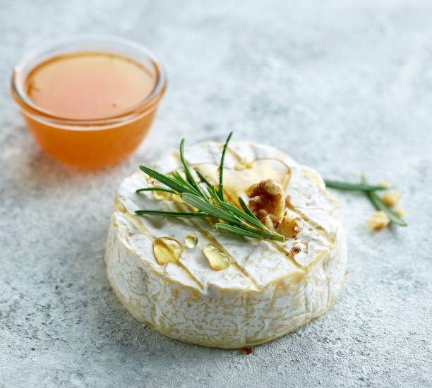 istock fresh brie cheese with rosemary 1331410181