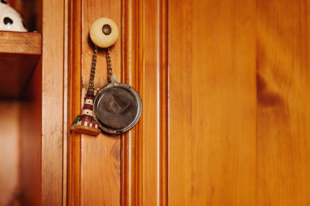 istock Tea infuser with little lighthouse hanging from sideboard in the kitchen 1331415745