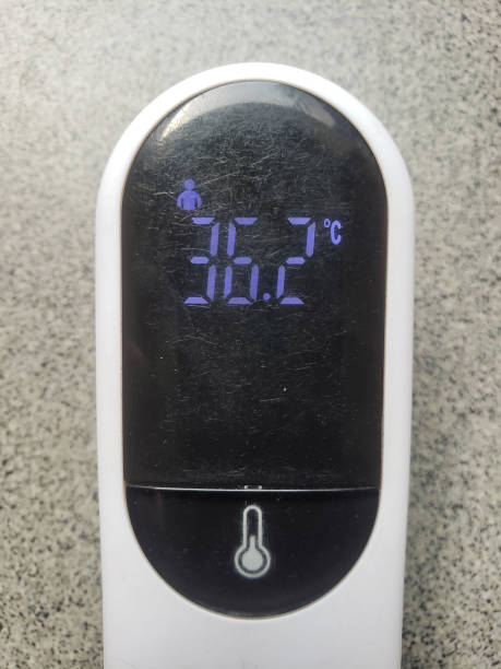 istock close up thermogun at normal body temperature 1331417843