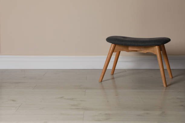 istock Stylish stool near beige wall indoors. Space for text 1331420786