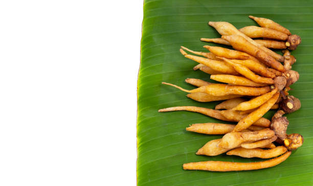 istock Finger root on banana leaves on white background. 1331421701