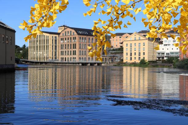 Norrkoping, Sweden Norrkoping town in Sweden. Ostergotland County. Revitalized industrial architecture reflection in river Motala.- Autumn leaves - autumn season view. ostergotland stock pictures, royalty-free photos & images