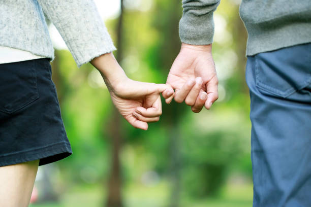 istock couple holding hands showing love on valentines day 1331423975