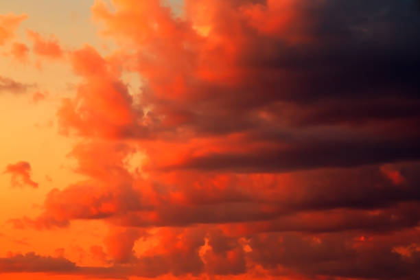 istock Red orange yellow epic dramatic scary mystical sunset sky with black clouds before thunderstorm storm, bright fantastic colorful sky landscape background 1331424186