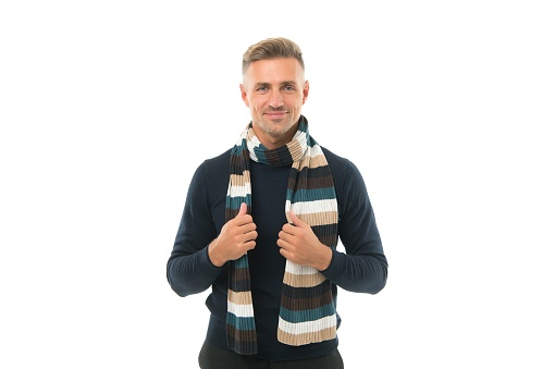 looking elegant. handsome smiling mature guy. male fashion for cold season. say no to flu. man in warm knitting isolated on white. happy unshaven man in winter scarf. feel cozy and comfortable.