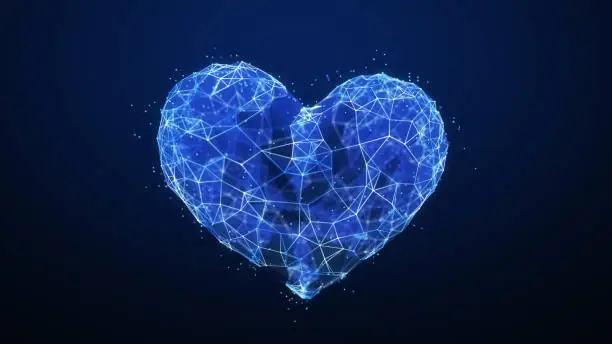 Photo of 3D heart is assembled from dots and lines on a dark blue background.