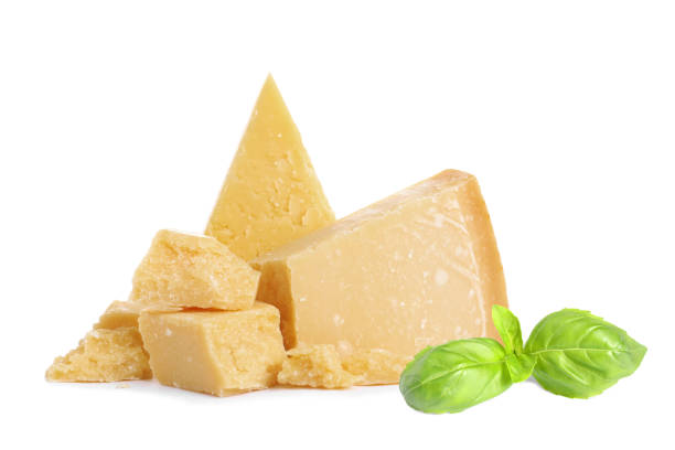 istock Delicious parmesan cheese and basil on white background 1331427335