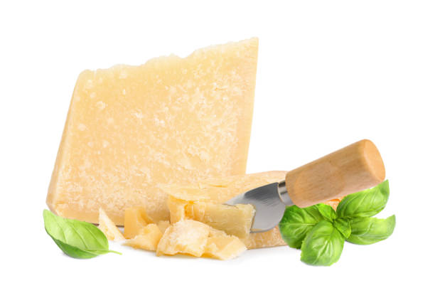 istock Delicious parmesan cheese and basil on white background 1331427939