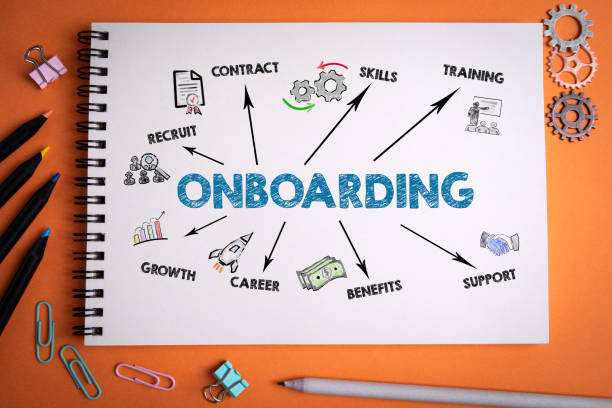 onboarding concept. notebook on an orange background - onboarding imagens e fotografias de stock
