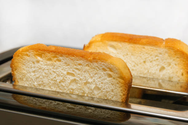 istock Two crispy toasters are in the toaster. Bread slices are prepared for breakfast. 1331429648