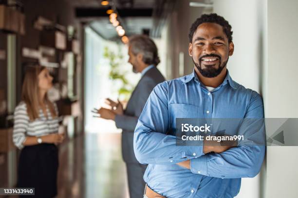 Mature Cheerful African American Executive Businessman At Workspace Office Stock Photo - Download Image Now