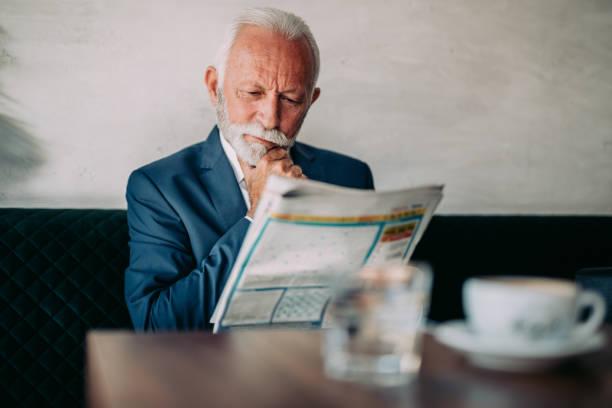 istock Senior business man at restaurant table 1331435933