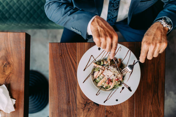 istock Senior businessman at restaurant table 1331436072