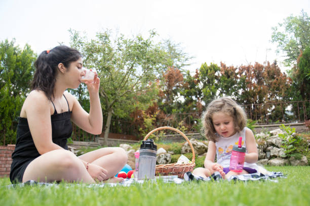 istock Girls having a picnic 1331436461
