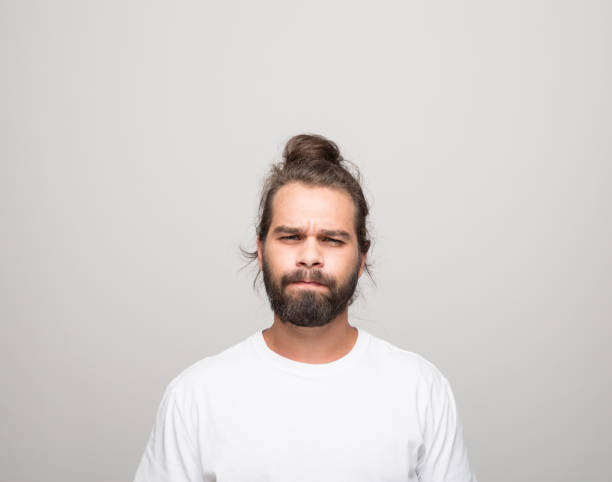 istock Headshot of angry young man 1331437483