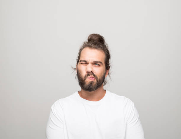 istock Headshot of confused young man 1331437737