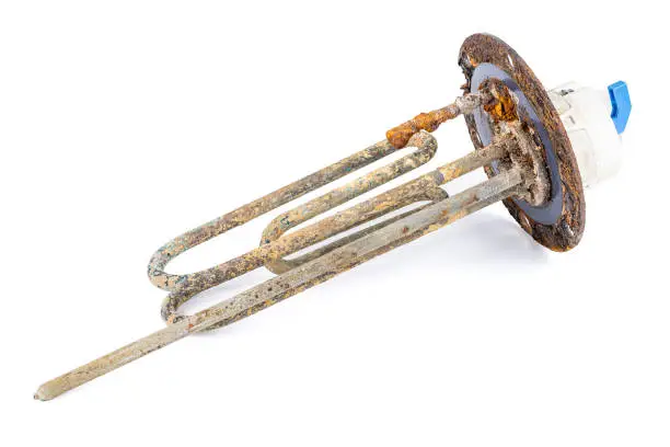 Photo of old broken electric water boiler heating element isolated on white background. damaged heating element with sediment and scum cut out