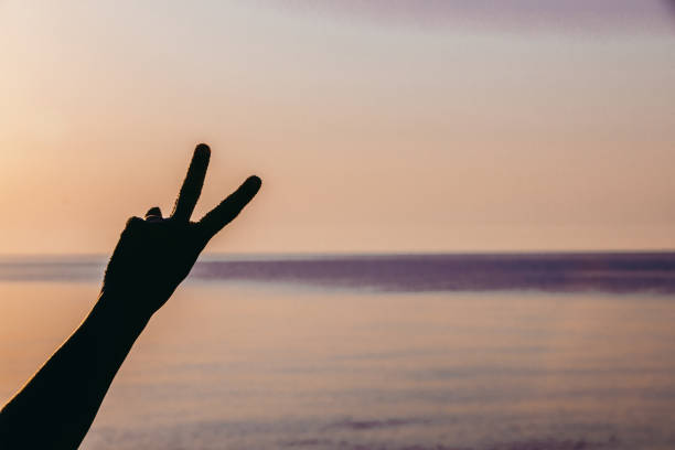 istock man hand showing different symbol. carefree 1331439394