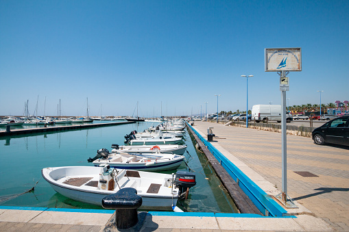 Associazione Nautica Falco Azzurro in San Leone, Sicily, with cars and boat engine manufacturers visible in the background