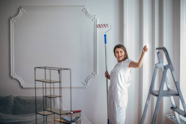 istock Charming woman painting at home 1331445089