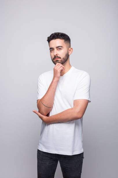 istock Thoughtful young man in white t-shirt 1331446001