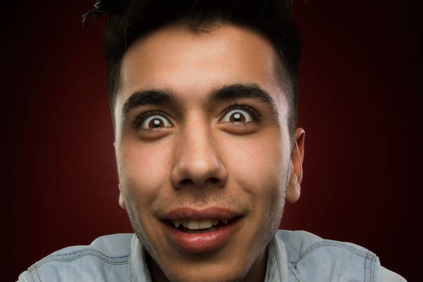 istock portrait of young man looking joyful and silly 1331448708