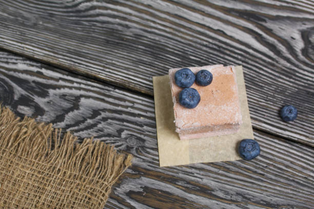 istock Portion marshmallow on linen fabric. Decorated with blueberries. Close-up shot. 1331449039
