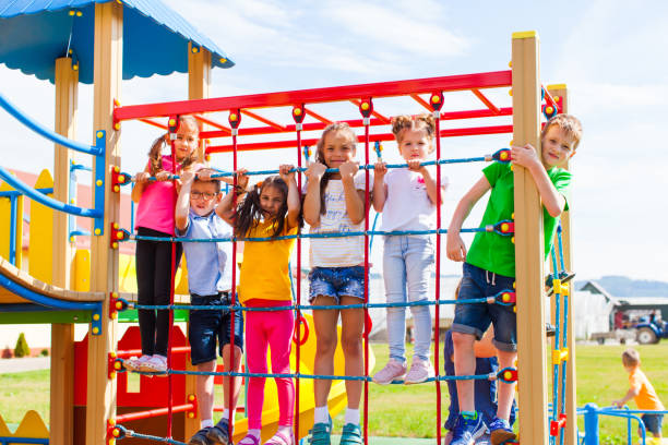 istock Children Playing In Playground 1331450556